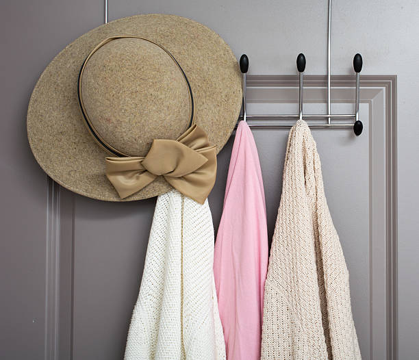 senior woman cardigans on a clothes rack inside bedroom or hotel door