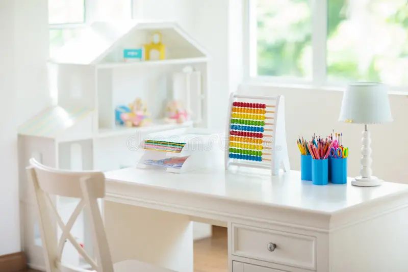 a table containing the pencil boxes, lamp, abacus etc