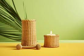 two Wicker Candle Holders one has a candle