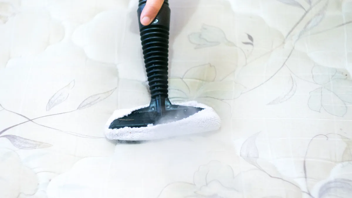 a hand cleaning Mattress using detergent at Home